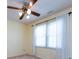 Bedroom featuring a ceiling fan and bright natural light from the large window at 2906 Crescent Knoll Dr, Matthews, NC 28105