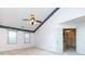 An empty bedroom with high ceilings, carpet, a ceiling fan, and white trim at 2906 Crescent Knoll Dr, Matthews, NC 28105