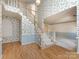 Spacious foyer featuring a staircase leading to the upper level, complemented by patterned wallpaper at 2906 Crescent Knoll Dr, Matthews, NC 28105