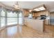 Bright kitchen and dining area with hardwood floors and large windows offering plenty of natural light at 2906 Crescent Knoll Dr, Matthews, NC 28105