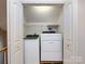 A laundry closet with stacked white washer and dryer, and white wire shelving at 2906 Crescent Knoll Dr, Matthews, NC 28105