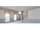 Bright living room with large windows, striped wainscoting, decorative wallpaper border, and plush carpeting at 2906 Crescent Knoll Dr, Matthews, NC 28105