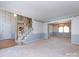 Open living area featuring a staircase, and an adjacent dining room with a chandelier at 2906 Crescent Knoll Dr, Matthews, NC 28105