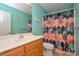 Bathroom with a modern vanity and colorful geometric pattern shower curtain at 2981 Deep Cove Nw Dr, Concord, NC 28027