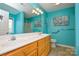 This bathroom features a double sink vanity, a large mirror, and teal walls at 2981 Deep Cove Nw Dr, Concord, NC 28027