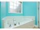 This is a close up of the bathtub that features a window over the tub at 2981 Deep Cove Nw Dr, Concord, NC 28027