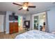 The main bedroom features a flat screen TV and sliding glass door to the sunroom at 2981 Deep Cove Nw Dr, Concord, NC 28027