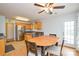 Open kitchen with oak cabinets, stainless appliances, granite countertops and a dining area at 2981 Deep Cove Nw Dr, Concord, NC 28027