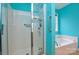 This bathroom features a clear shower with a glass door and a built in seat at 2981 Deep Cove Nw Dr, Concord, NC 28027