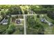 Aerial view of home site, showing other homes and ample green space within a wooded community at 3500 Manna Ln, Mount Holly, NC 28120