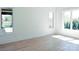 Inviting bedroom with large windows that bring in natural light and light hardwood flooring at 3500 Manna Ln, Mount Holly, NC 28120