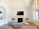 The living room offers bright, airy spaces with fireplace, large windows and light hardwood floors at 3500 Manna Ln, Mount Holly, NC 28120