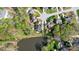 Aerial view of homes in a wooded neighborhood, with lush yards and lake at 4715 Amberside Dr, Rock Hill, SC 29732