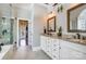 Bathroom with double vanity, granite counters, custom cabinets, and a glass shower at 4715 Amberside Dr, Rock Hill, SC 29732