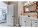Bathroom with white vanity, decorative mirror, and view into bedroom at 4715 Amberside Dr, Rock Hill, SC 29732