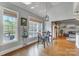 Sunlit dining area offers beautiful views with hardwood floors, a modern light fixture, and a casual atmosphere at 4715 Amberside Dr, Rock Hill, SC 29732