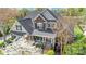 Inviting two-story home with a brick facade, covered porch, and lush landscaping in a quiet neighborhood at 4715 Amberside Dr, Rock Hill, SC 29732