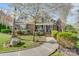 Charming two-story brick home featuring a beautifully landscaped front yard and inviting walkway at 4715 Amberside Dr, Rock Hill, SC 29732