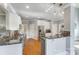 Well-appointed kitchen boasts granite countertops, stainless steel appliances, and an open design with hardwood floors at 4715 Amberside Dr, Rock Hill, SC 29732