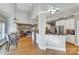 Open-concept living area with hardwood floors, a kitchen island with seating, and an abundance of natural light at 4715 Amberside Dr, Rock Hill, SC 29732