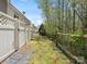Fenced backyard with both wood and white picket fencing and grassy area at 475 Delta Dr, Fort Mill, SC 29715