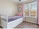 Cozy bedroom featuring a storage bed, window, and pink curtains for a room at 475 Delta Dr, Fort Mill, SC 29715