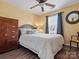 Comfortable bedroom featuring a wooden bed frame, a ceiling fan, and natural light at 475 Delta Dr, Fort Mill, SC 29715