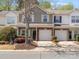 Charming two-story townhome with a well-manicured lawn and an attached one-car garage at 475 Delta Dr, Fort Mill, SC 29715