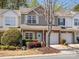 Charming two-story townhome with a well-manicured lawn and an attached one-car garage at 475 Delta Dr, Fort Mill, SC 29715