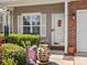 Welcoming front porch with decorative plants and a charming welcome sign near the front door at 475 Delta Dr, Fort Mill, SC 29715