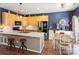 Eat-in kitchen with wooden cabinets, quartz countertops, an island, and stainless steel appliances at 475 Delta Dr, Fort Mill, SC 29715