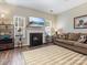 Inviting living room with a cozy fireplace and a mounted flat screen TV at 475 Delta Dr, Fort Mill, SC 29715