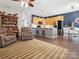 Open living area with kitchen view, bar stool seating, and natural light at 475 Delta Dr, Fort Mill, SC 29715