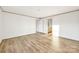 Bright bedroom with wood-look floors, neutral colors, and closet access create a relaxing retreat at 501 Mt. Wesley Church Rd, Hiddenite, NC 28636