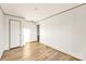 Empty bedroom with modern flooring, two doors, and neutral walls at 501 Mt. Wesley Church Rd, Hiddenite, NC 28636