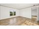 Cozy bedroom featuring wood-look floors and window views for a relaxing space at 501 Mt. Wesley Church Rd, Hiddenite, NC 28636