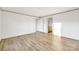 Bright bedroom with wood-look floors, neutral colors, and closet access create a relaxing retreat at 501 Mt. Wesley Church Rd, Hiddenite, NC 28636