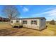 Charming single-story home showcasing a cozy front porch and neutral-tone siding at 501 Mt. Wesley Church Rd, Hiddenite, NC 28636