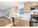 Well-lit kitchen featuring modern appliances, stainless sink, and laminate floors at 501 Mt. Wesley Church Rd, Hiddenite, NC 28636