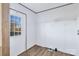 Practical laundry room with window for natural light and shelving at 501 Mt. Wesley Church Rd, Hiddenite, NC 28636