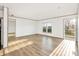 Bright living room featuring hardwood floors, modern trim, and natural light at 501 Mt. Wesley Church Rd, Hiddenite, NC 28636