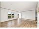 Bright living room with wood-look flooring and neutral walls offers a spacious feel at 501 Mt. Wesley Church Rd, Hiddenite, NC 28636