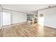 Spacious living room with wood flooring, natural light and view of kitchen and eat-in island at 501 Mt. Wesley Church Rd, Hiddenite, NC 28636