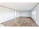 Large open living room features hardwood floors, natural light and transitions to other rooms in the home at 501 Mt. Wesley Church Rd, Hiddenite, NC 28636