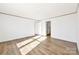 Bright bedroom featuring wood-look floors, neutral paint, and ample natural light at 525 Mt. Wesley Church Rd, Hiddenite, NC 28636