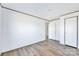 A bedroom with neutral walls, modern flooring, and two doors at 525 Mt. Wesley Church Rd, Hiddenite, NC 28636