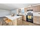 Well-lit kitchen with stainless steel appliances, a center island, and modern wood cabinets at 525 Mt. Wesley Church Rd, Hiddenite, NC 28636