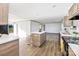 Bright, open kitchen with island, modern appliances, and wood-look flooring at 525 Mt. Wesley Church Rd, Hiddenite, NC 28636