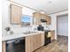 Functional kitchen design with stainless steel appliances, wood cabinets, and a double sink at 525 Mt. Wesley Church Rd, Hiddenite, NC 28636