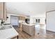 Bright kitchen area featuring marble countertops, wood-look floors, an island, and stainless appliances at 525 Mt. Wesley Church Rd, Hiddenite, NC 28636